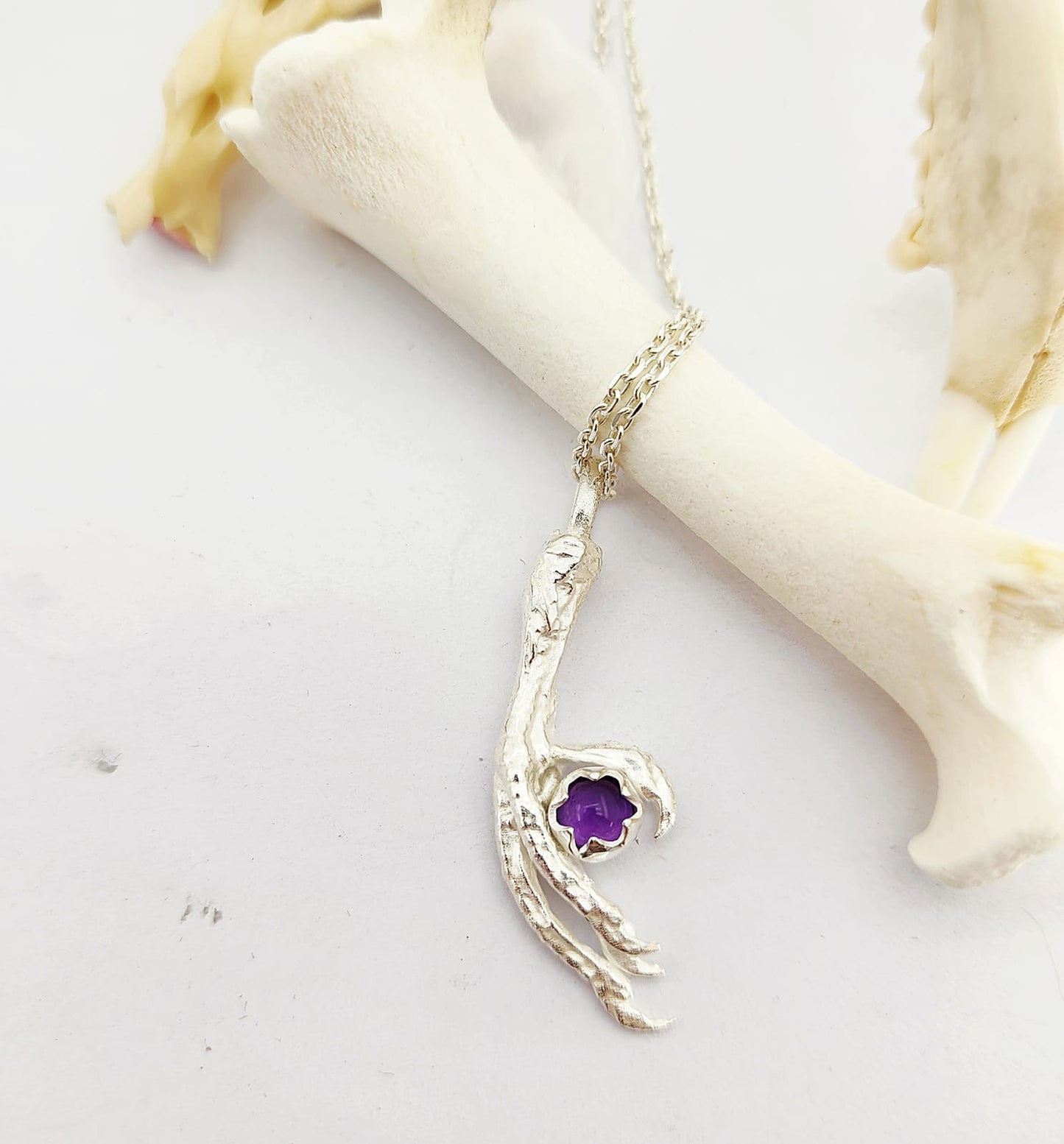 Claw with Amethyst Pendant