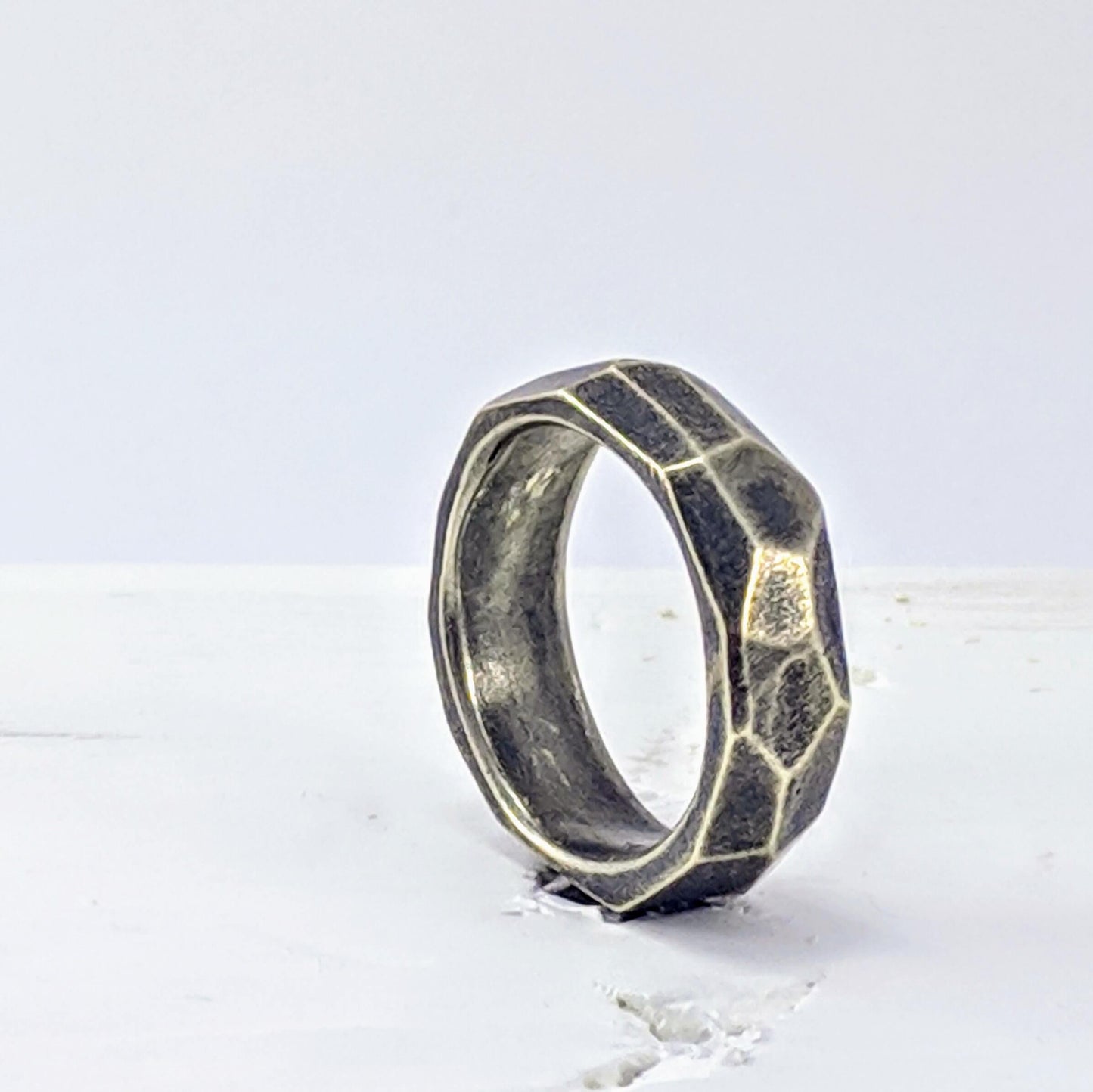 The Angle Ring is a signature design from NZ jeweller Buster Collins. A chunky and comfortable ring in sterling silver or warm bronze.