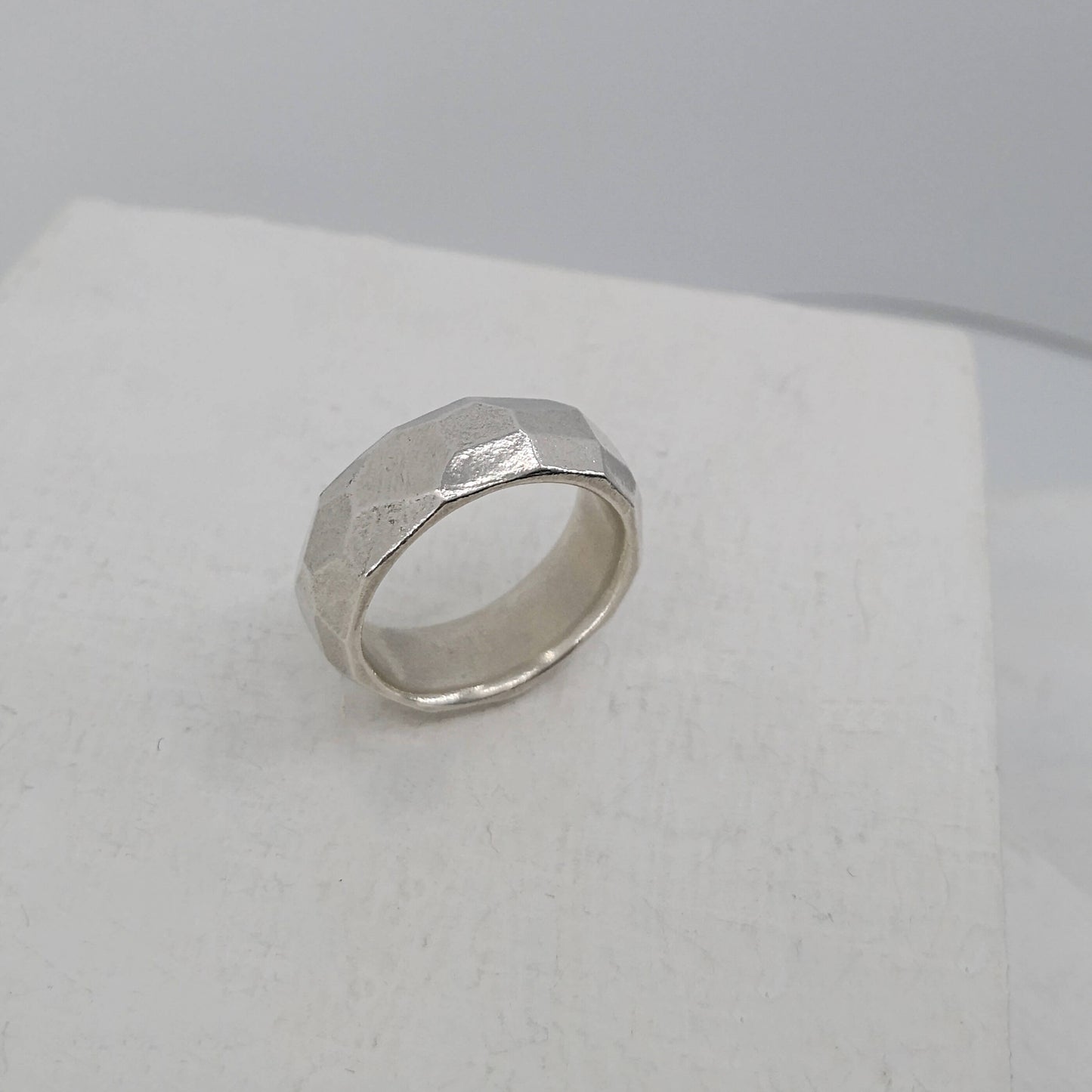 The Angle Ring is a signature design from NZ jeweller Buster Collins. A chunky and comfortable ring in sterling silver or warm bronze.