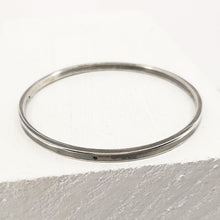 Load image into Gallery viewer, The Matariki Bangle in sterling silver, hand crafted in NZ by Buster Collins.