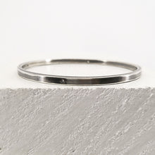 Load image into Gallery viewer, The Matariki Bangle in sterling silver, hand crafted in NZ by Buster Collins.