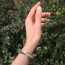Load image into Gallery viewer, The Textured Curved Bracelet by Buster Collins in oxidised sterling silver and 22ct gold fused to the surface. Unique NZ made jewellery available at Mason and Collins.

