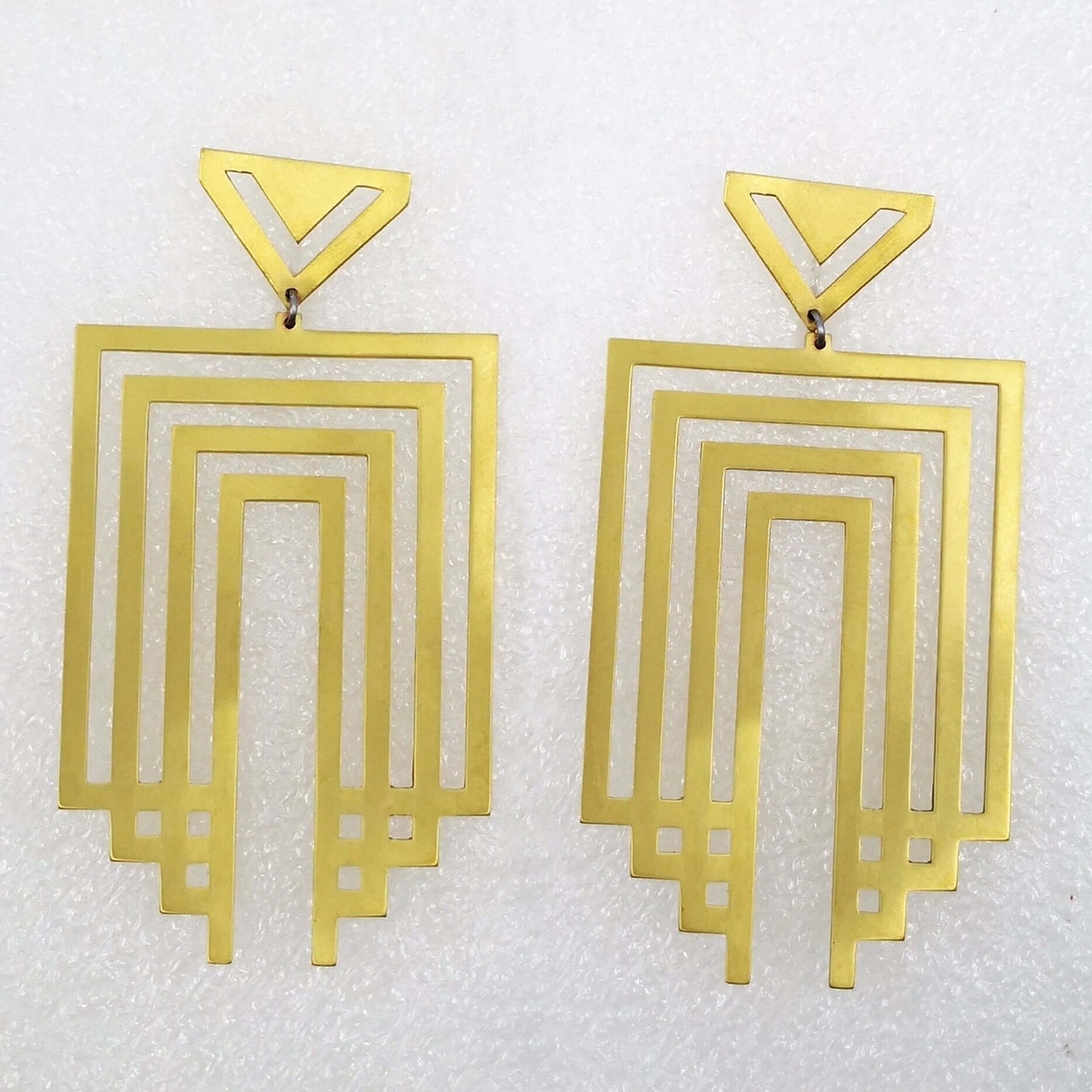 The Empire State earrings in brushed brass hand crafted by Banshee the Valkyrie. Unique NZ jewelery at Mason & Collins.