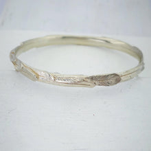 Load image into Gallery viewer, The feather bracelet in bright sterling silver from iconic NZ jewellery brand The Wild.