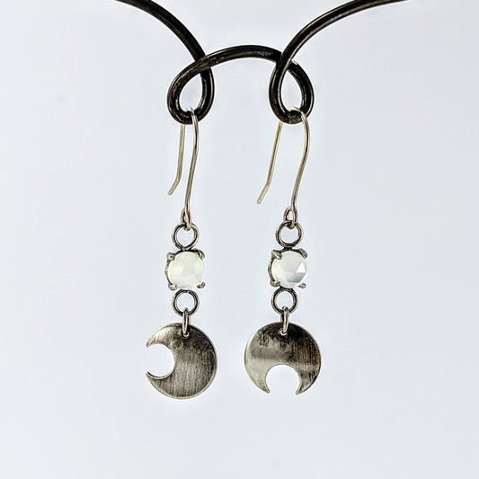 The silver and moonstone Celestial Phase earrings handmade in NZ by Buster Collins.