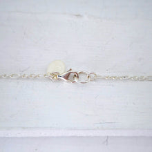 Load image into Gallery viewer, The Huia Beak Charm Pendant from The Wild Jewellery is a best seller. Simple, elegant and comfortable, with a secure sprung catch, this is a classic piece to wear everyday.