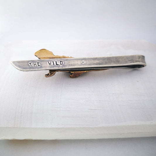 The Tuatara Tie Slide in sterling silver and bronze with a light oxidised finish is hand crafted in NZ by The Wild Jewellery.