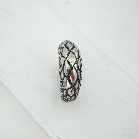 The Tuatara Ring is carved with a scale texture inspired by the skin of the endangered Tuatara. Hand crafted in NZ by The Wild Jewellery.