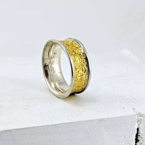 The wide Text-ure ring in silver and gold by NZ jeweller David McLeod.