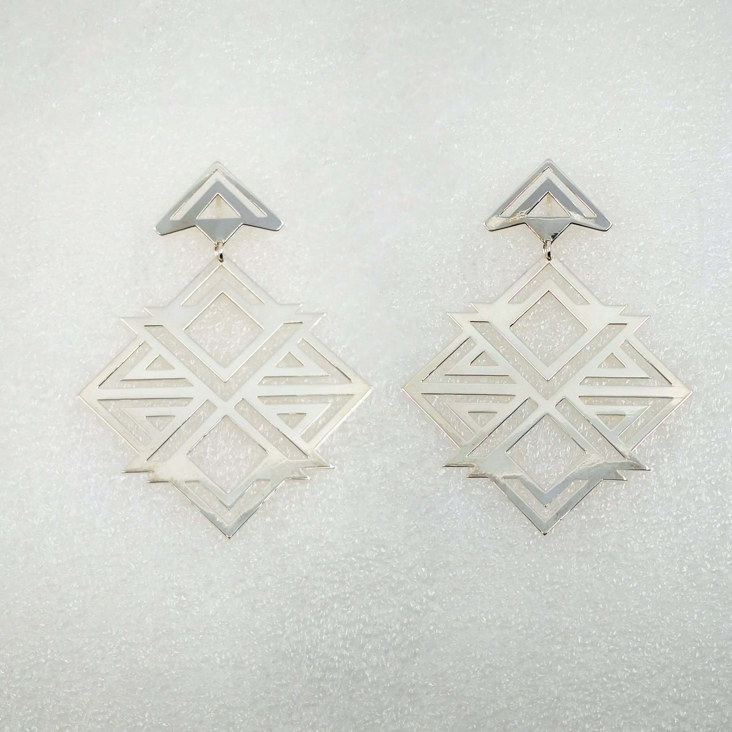 X-box Earrings in silver-plated brass, handmade jewellery by NZ artist Banshee the Valkyrie. These statement earrings have solid silver hooks.