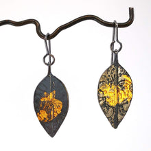Load image into Gallery viewer, Pohutukawa leaf earrings in textured oxidised silver with 24ct gold details. These are made by HerbertandWilkes. Amazing hand crafted NZ jewellery at Mason and Collins. 
