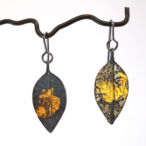 Pohutukawa leaf earrings in textured oxidised silver with 24ct gold details. These are made by HerbertandWilkes. Amazing hand crafted NZ jewellery at Mason and Collins. 