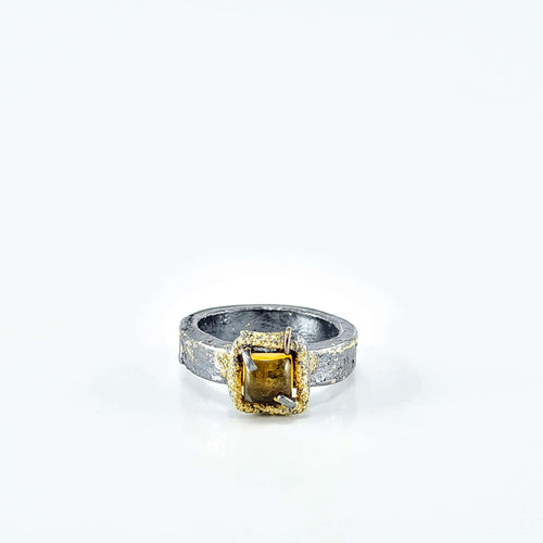 A chunky silver and gold ring set with a square citrine cabachon . Hand made NZ jewellery by Natalie Salisbury Jewellery. Available at Mason and Collins,