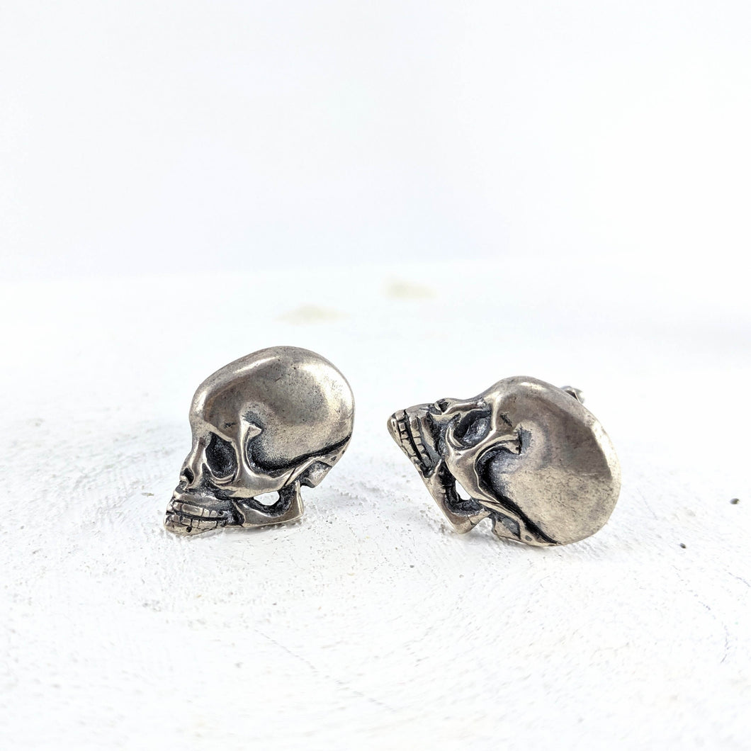 These carved skull cufflinks are hand crafted in sterling silver by NZ jeweller Banshee the Valkyrie. Available at Mason and Collins, quality silver NZ made jewellery.