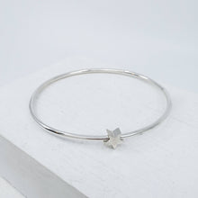 Load image into Gallery viewer, Solid sterling silver star bangle by Zoë Porter. Available now at Mason and Collins. 
