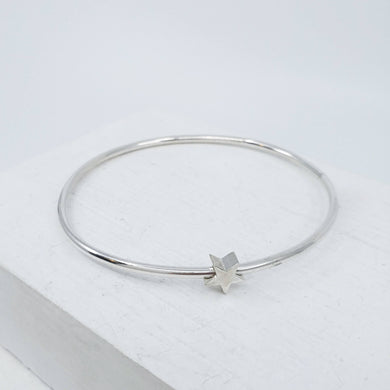 Solid sterling silver star bangle by Zoë Porter. Available now at Mason and Collins. 