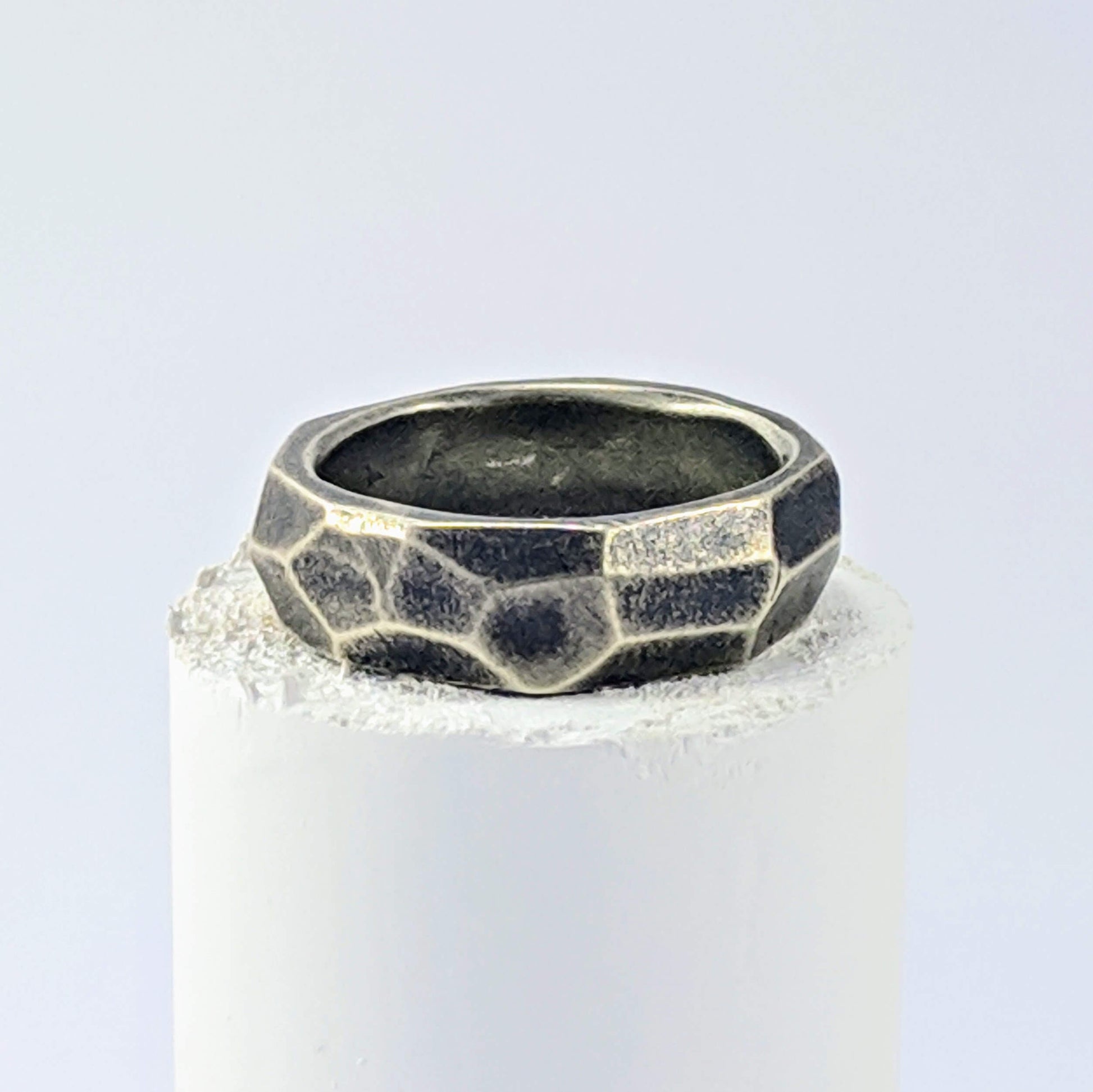 The Angle Ring is a signature design from NZ jeweller Buster Collins. A chunky and comfortable ring in sterling silver or warm bronze.