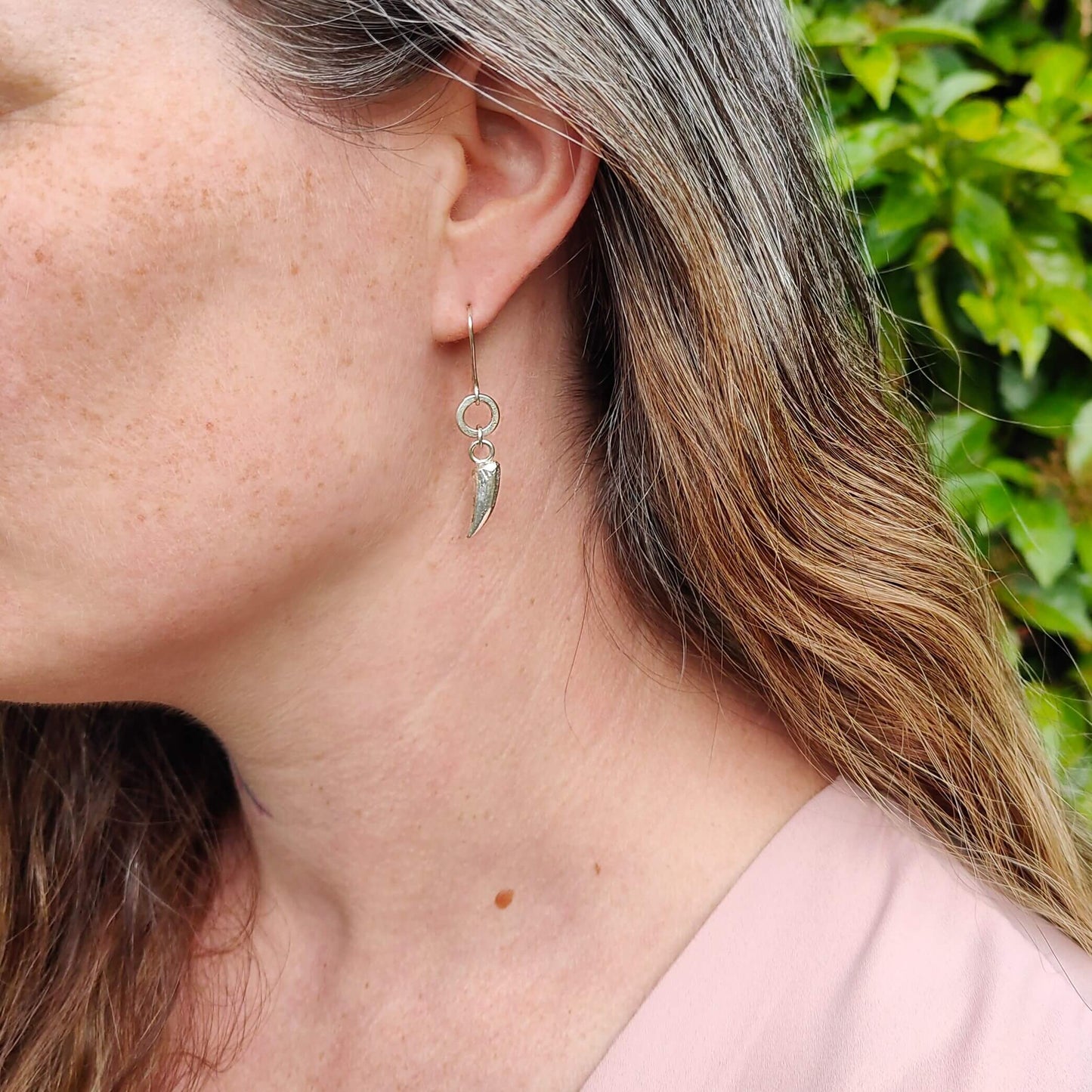 The Tusk Earrings in bright sterling silver, hand made NZ earrings by Buster Collins