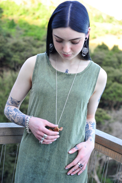 Our model wears the Doe's Head Necklace by NZ jeweller Vaune Mason.