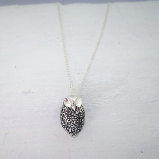 Ruru pendant in solid sterling silver on a sterling silver chain. Handmade by Ruru Jewellery.