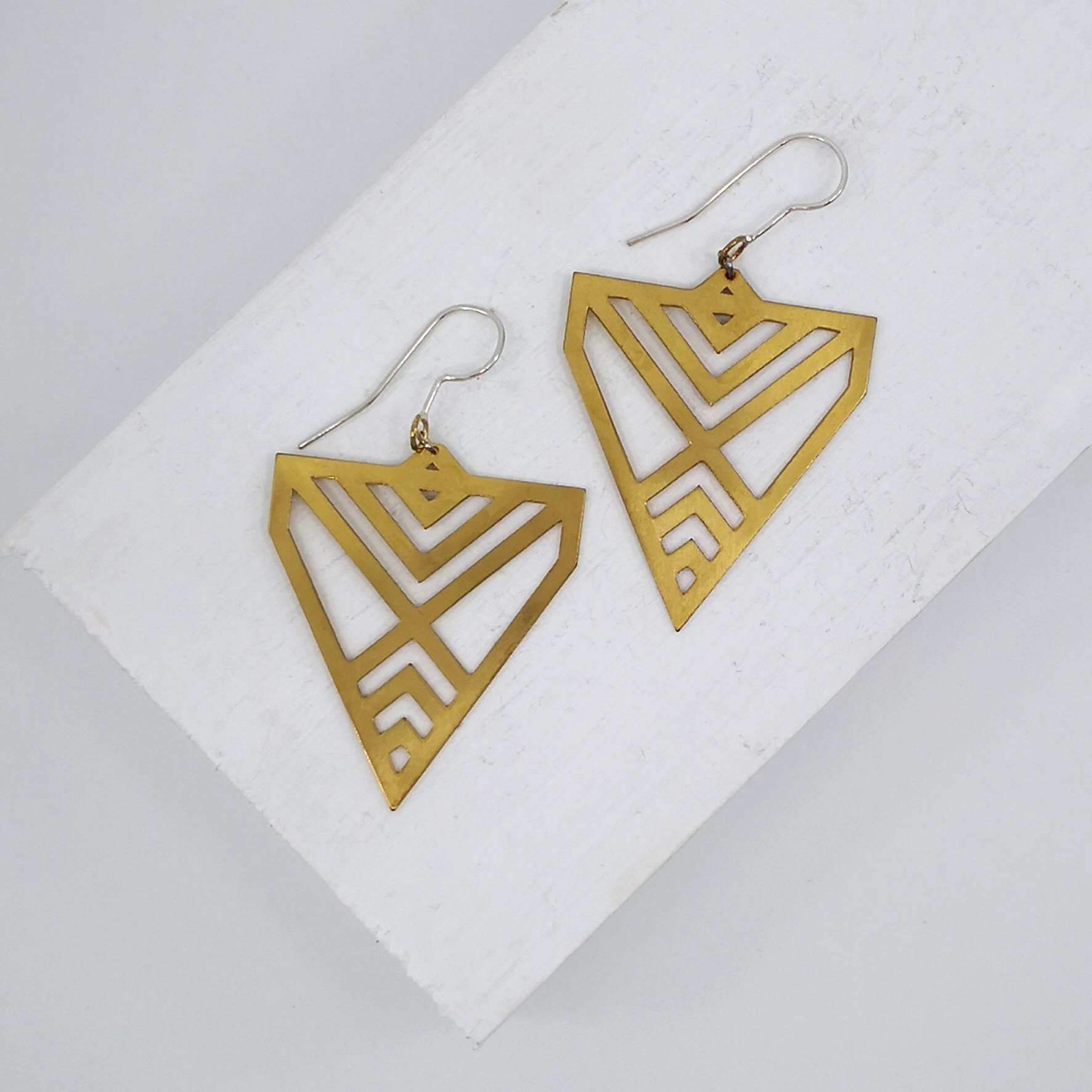 The Aronui earrings in brass on sterling silver hooks. Quality NZ made jewellery from Banshee the Valkyrie at Mason & Collins.