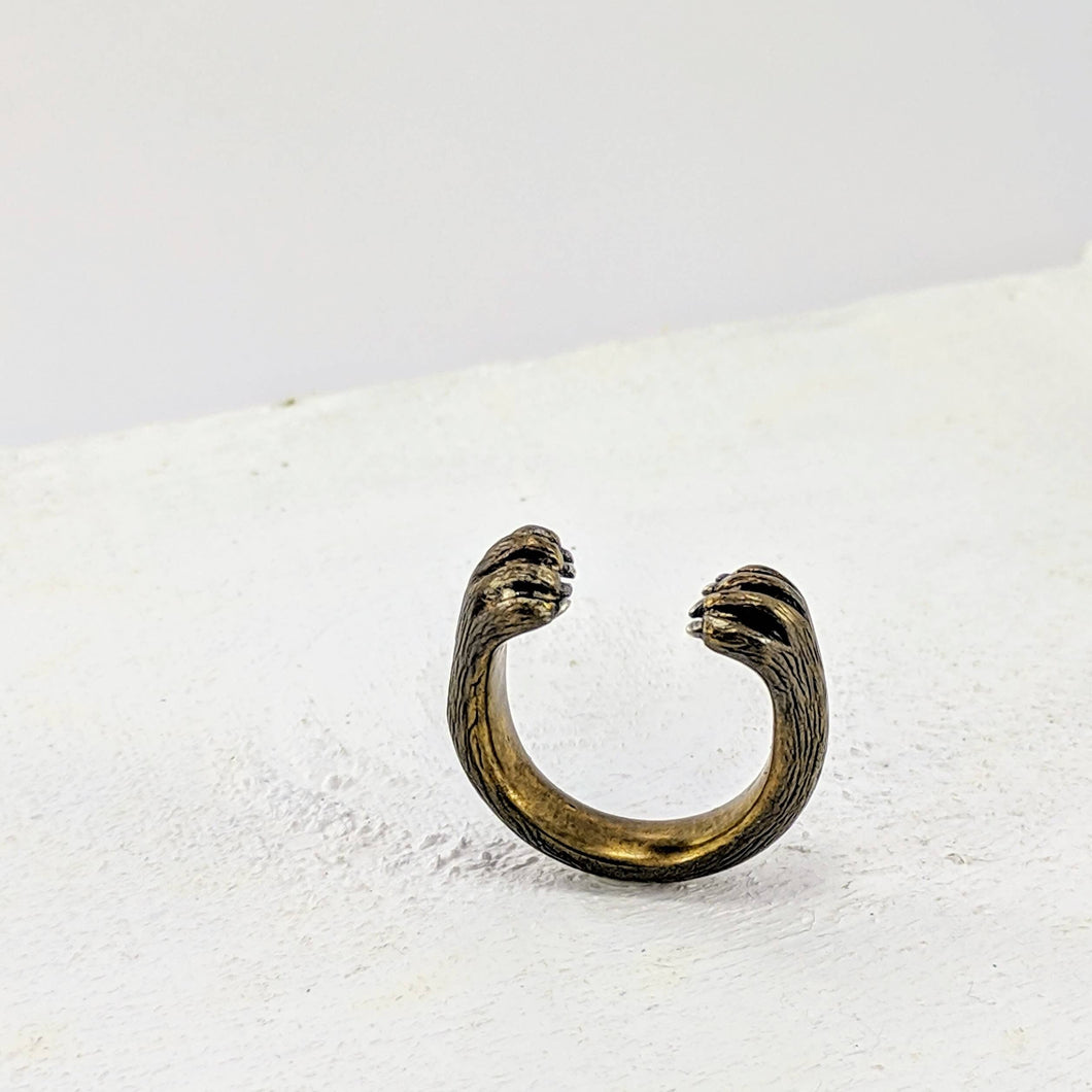 The Bear Hug Ring by NZ jeweller Vaune Mason has two bear paws encircling your finger. The Ring is made in warm bronze and the claws are sterling silver.
