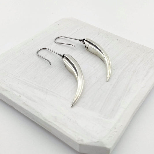 Handmade silver earrings by The Wild Jewellery NZ - the huia beak earrings in solid silver. 