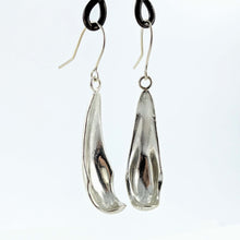 Load image into Gallery viewer, The silver petal earrings by NZ jeweller Buster Collins are simple and sleek easy-to-wear jewellery.
