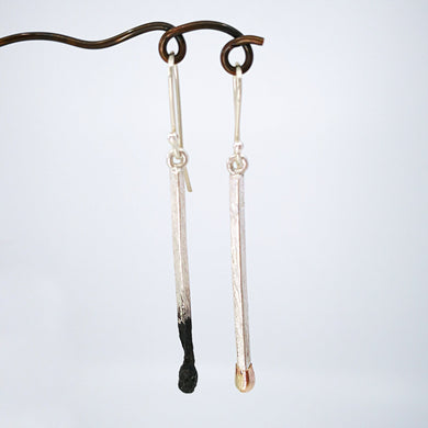 The Burnt / Live Matchstick earrings by David McLeod are an iconic piece of NZ contemporary jewellery.