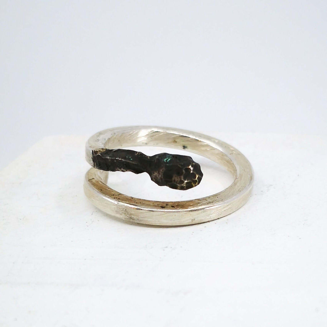 The Burnt Match Stick Ring is hand crafted by NZ jeweller David McLeod. A stunning solid sterling silver ring in a unique modern design available at Mason and Collins.