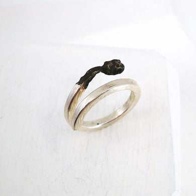 The Burnt Match Stick Ring is hand crafted by NZ jeweller David McLeod. A stunning solid sterling silver ring in a unique modern design available at Mason and Collins.