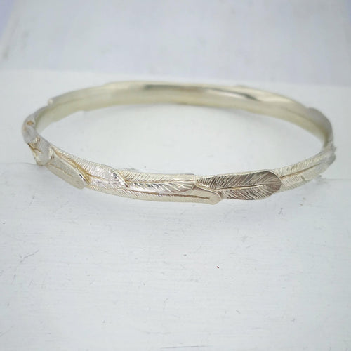 The feather bracelet in bright sterling silver from iconic NZ jewellery brand The Wild.