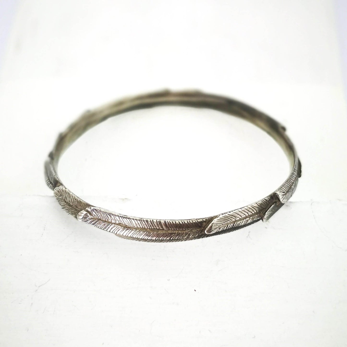 The feather bracelet in oxidised sterling silver from iconic NZ jewellery brand The Wild.