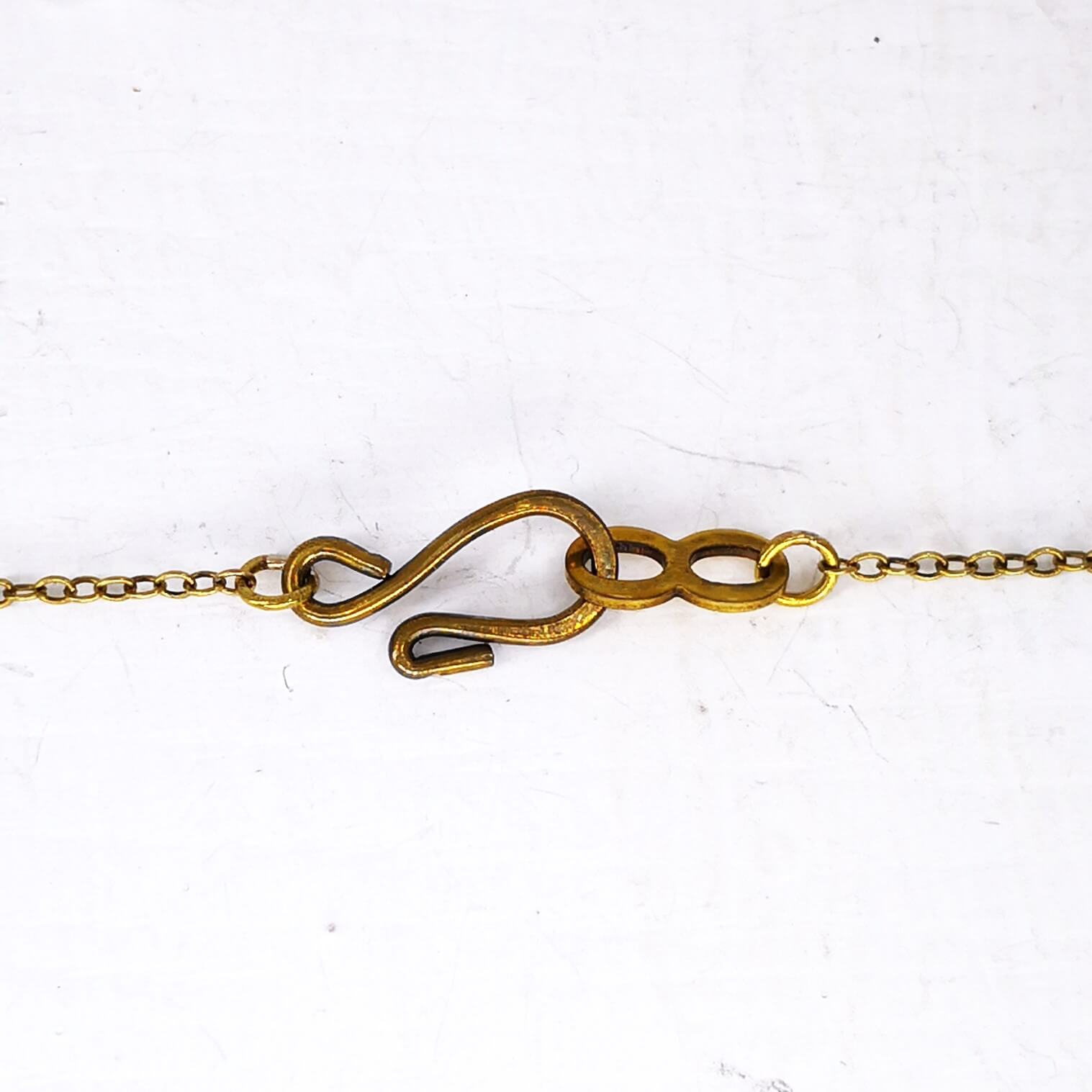 The sturdy hook and eye catch used on The Fern Frond Pendant in bronze.