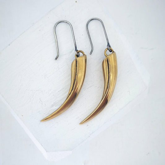The huia beak earrings in solid bronze on sterling silver hooks. Unique NZ jewellery from The Wild.
