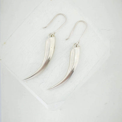 Solid silver Huia Beak earrings handmade NZ jewellery by The Wild.