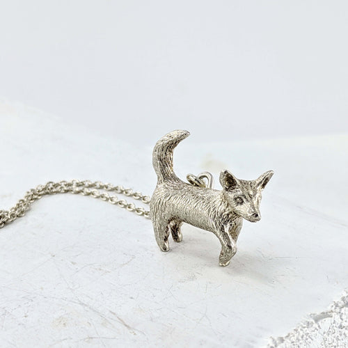 Silver Dog Pendant handmade by Vaune Mason. This cute wee dog hangs from a sturdy solid silver chain. Quality silver jewellery available at Mason and Collins.