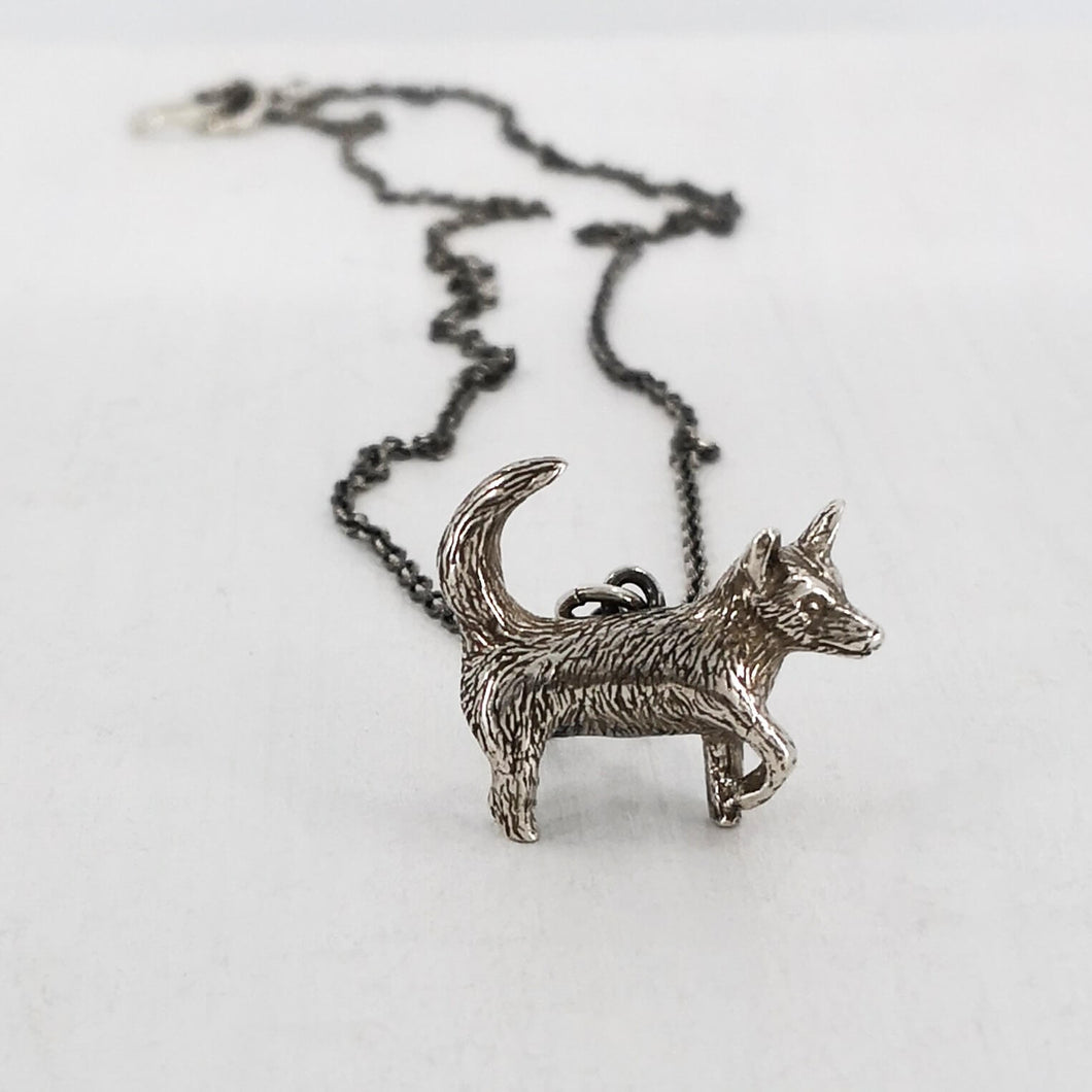 Silver Dog Pendant handmade by Vaune Mason. This cute wee dog hangs from a sturdy solid silver chain. Quality silver jewellery available at Mason and Collins.