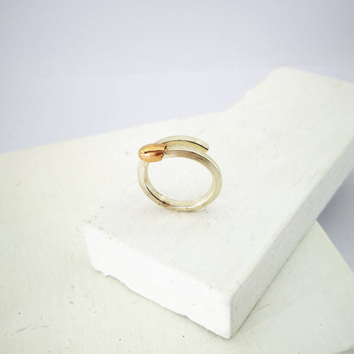 The Live Match Stick Ring by David McLeod is handcrafted in solid sterling silver and rose gold.