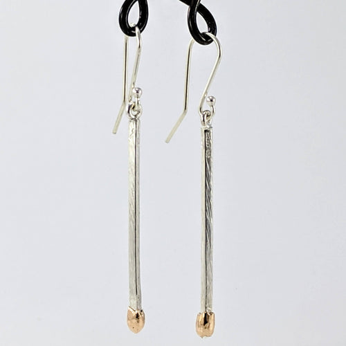 Live Matchstick earrings handcrafted in solid sterling silver with cleverly made 9ct rose gold heads by David Mcleod.