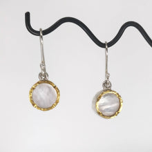 Load image into Gallery viewer, These classic drop earrings are hand crafted in sterling silver and mother of pearl shell. The rim on the front has a 22ct yellow gold trim so the earrings really catch the light. Made by David McLeod and available through Mason and Collins. 
