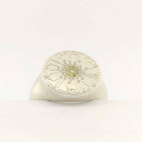 The Mount Cook Buttercup signet ring by Adele Stewart. NZ jewellery, handcrafted in sterling silver and set with a AAA grade yellow sapphire. 