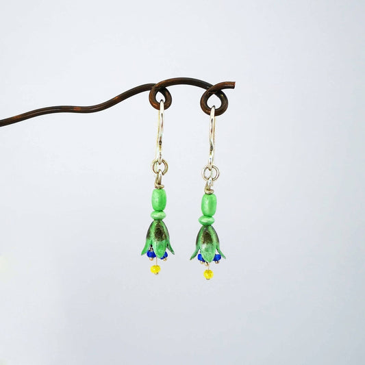 These delicate little flower earrings are perfectly hand-crafted to resemble the native fuschia flower. Made by Adele Stewart in silver and enamel. Available now at Mason and Collins.