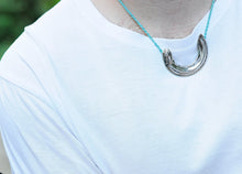 Load image into Gallery viewer, The Whitebait or Inanga Pendant is hand-crafted in solid sterling silver by NZ jeweller Vaune Mason.
