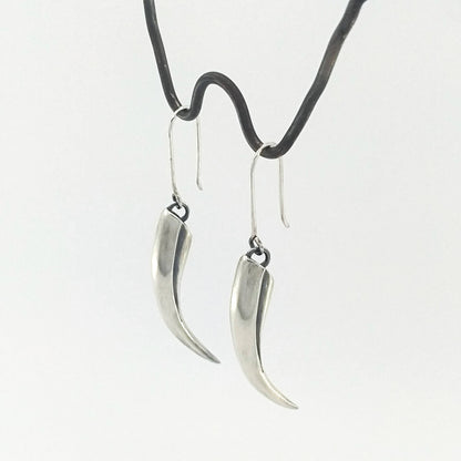 Handmade silver earrings by The Wild Jewellery NZ - the huia beak earrings in solid silver.
