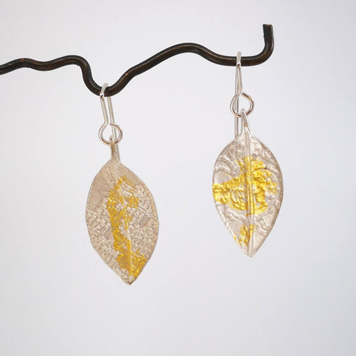 The Pohutukawa earrings from Herbert & Wilks are textured with a delicate lace pattern and 24 carat gold leaf.  Available now from Mason and Collins. 