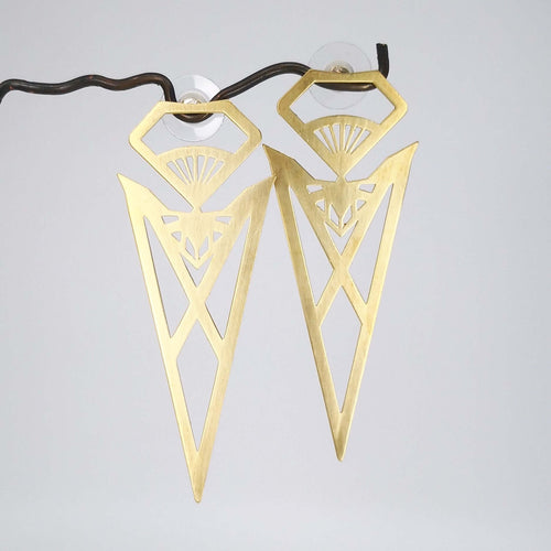 The bold brass Pohutukawa-Blood-Brother earrings from Banshee the Valkyrie. Unique NZ made jewellery at Mason & Collins.