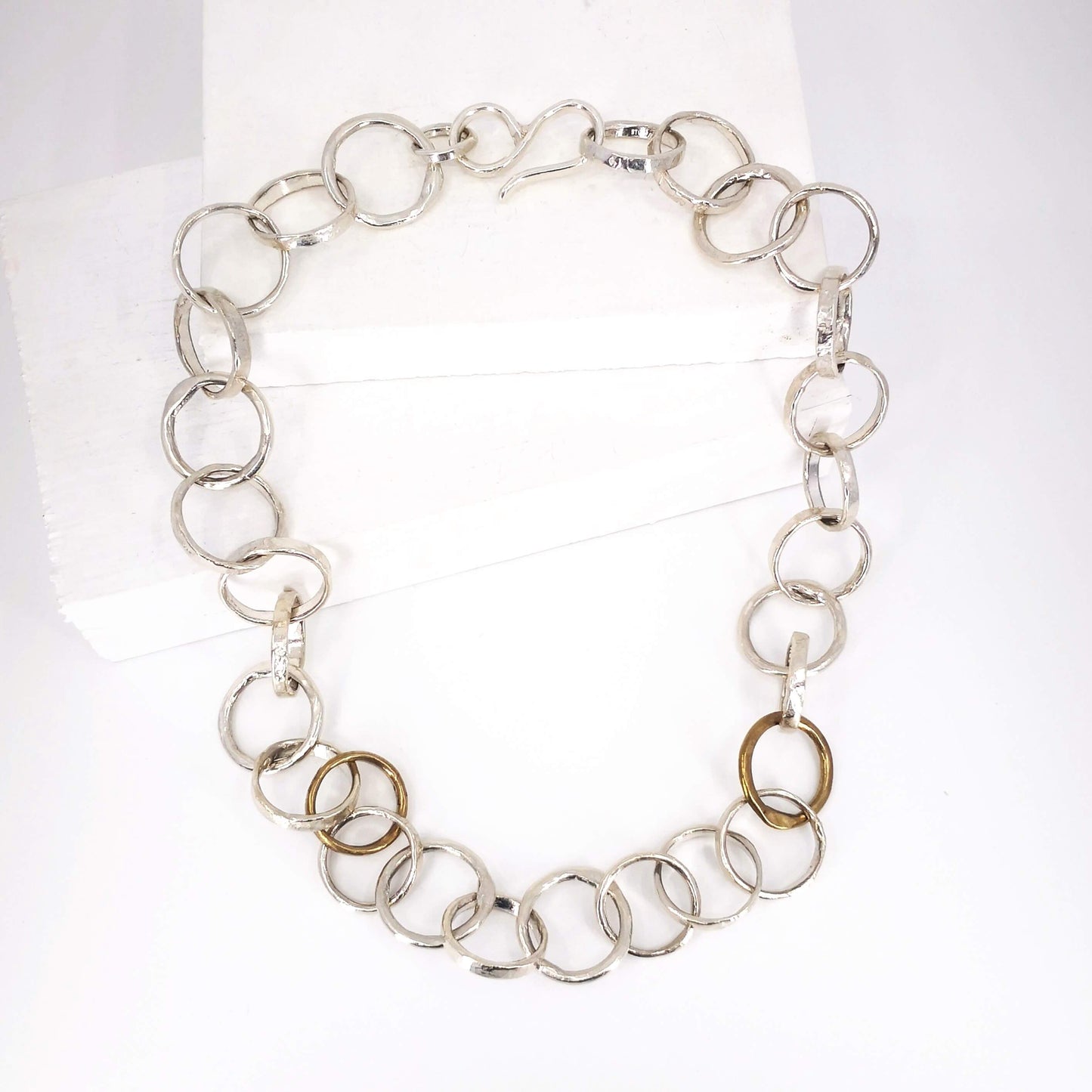 The Organic Tales necklace from Herbert and Wilks is hand crafted and finished each link at a time! Cast in solid sterling silver and bronze, this fabulous piece is a real statement.