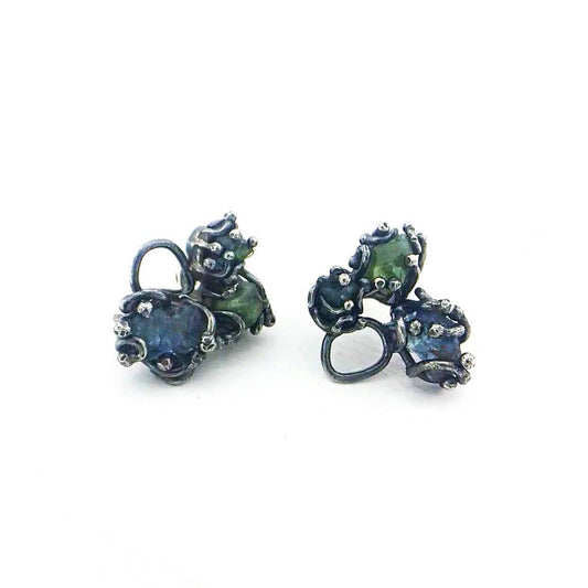 The gemstone cluster studs are totally one-of-a-kind, featuring raw gemstones in oxidised sterling silver. By NZ jeweller Vaune Mason.