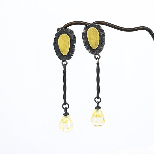 These delicate drop earrings are crafted in silver and 18 carat gold with delicate yellow cubic zirconia drops.